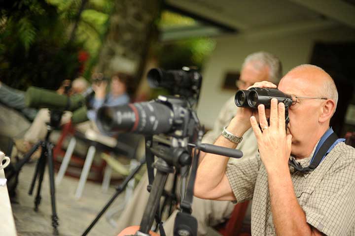Birders at Canopy Lodge looking through binoculars
